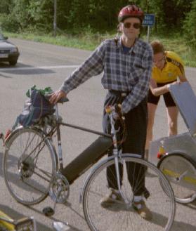 Juhani and his electric-assist bike, with Erik in the background looking for something in the 'boot' of his bike