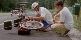 Onni's Dad and Pekka Rautiainen making running repairs to the trike