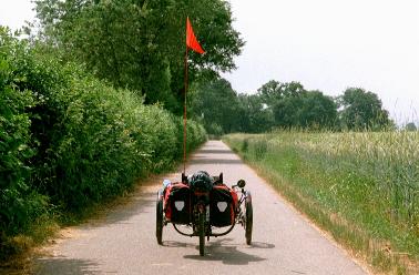 Trike in an avenue of hedges and barley, near the Katzensee (Regensdorf)